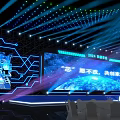 Contemporary Stage Setup With Blue Lighting Large Screen Display Text And Geometric Decor 3d model