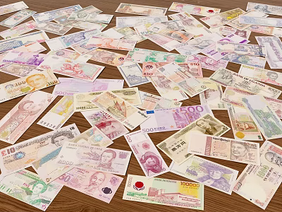 Decorative Ornament Set With Various Currency Banknotes Scattered On Wooden Tabletop 3d model