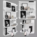 Stylish White Wall Mounted Shelving Unit With Decorative Frames Mugs And Books