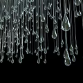 Water Drop Shaped Transparent Crystal Chandelier with Hanging Pendants Against Black Background