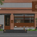 Cafe Storefront With Red Brick Wall Glass Windows Coffee Chai Tea Signage And Green Plants