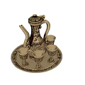 Elegant Golden Wine Bottle And Glasses Set With Intricate Patterns On Decorative Tray
