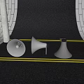 Three Commercial Megaphones Placed on Gray Ground With Yellow Line