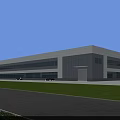 Modern Industrial Factory Building With Gray White Exterior Large Windows And Green Lawn Area