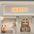 SKRENI Storefront Design With White Facade Orange Signage Arched Entrance And Potted Plant
