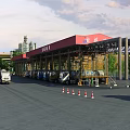 Industrial Factory Building With Red Roof Multiple Lanes And Trucks Near Traffic Cones