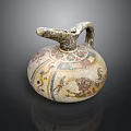 Artistic Ancient Pottery Jug Featuring Intricate Sculpture Carving And Painted Patterns