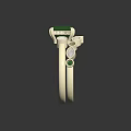 Gold ring adorned with square green gemstone and small white green surrounding decorative stones carved details