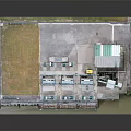 Industrial Processing Facility Model Featuring Green Building Blue Equipment And Concrete Ground
