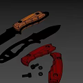 3D Rendered Tactical Knives With Black Orange Handles Red Parts And Metal Screws