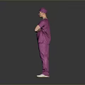 Full Length Portrait Of Man In Purple Scrubs And Surgical Cap Standing With Arms Crossed