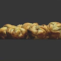 Fresh Twisted Steamed Buns Arranged in a Pile with Golden Brown Crust and Soft Inside