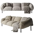 Plush Light Beige Three Seater Sofa With Geometric Throw Blanket And Black Metal Legs