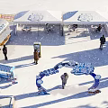 Snowy Winter Interactive Zone Featuring White Tents And Ice Decorations For Visitors