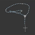 Shiny Blue Rosary Beads With Silver Cross Pendant On Dark Surface