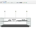 Shopping Mall Counter Featuring Glass Display Case With White Shirts Hats And Folded Merchandise