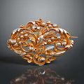 Ornate Gold Metal Accessory With Intricate Floral Pattern And Pearl Like Beads