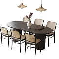 Modern Oval Dining Table and Woven Chairs Set with Pendant Lights White Vase and Book