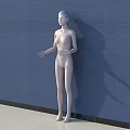 White Mannequin Standing Against Blue Wall With Light Floor Surface