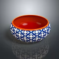Decorative Dinnerware Set With Blue And White Pattern And Orange Interior Bowl