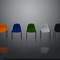 Modern Various Colored Chairs With Metal Legs On Grey Reflective Floor