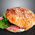 Tasty Ham Sandwich With Fresh Greens Creamy Sauce on Flour Dusted Crusty Bread
