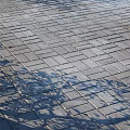Gray Outdoor Floor Tiles Neatly Arranged With Natural Tree Leaf Shadows