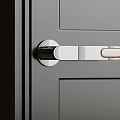 Modern Metal Door Handle with Sleek Design on Gray Door Panel for Contemporary Interior