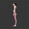 A Woman Adjusting Her Hair In Gray Sports Bra And Pink Leggings