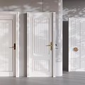 White Swing Doors With Three Different Panel Styles And Brass Handles Under Natural Light Shadows