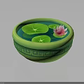 Pink Lotus Flower And Green Lily Pads In Green Patterned Bowl On Water Surface