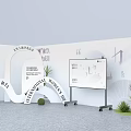 Modern Exhibition Booth Design With White Display Tables Product Racks Green Plants And Signage
