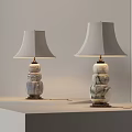 Two Modern Table Lamps With Stacked Marble Bases And Light Colored Shades On Display Stand 3d model