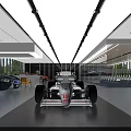 Spacious Modern Car Showroom With White Racing Car Blue Sports Car Large Windows And Furniture