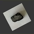 Natural Wooden Stone Specimen With Rough Surface Placed On Grid Paper