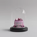 Pink Drizzle Cake With Top Decorations Under Glass Dome On Black Base