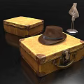 Vintage Yellow Suitcases With Brown Hat And Mannequin Stand On Black Surface