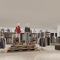 Modern Clothing Store Interior With Mannequins And Casual Apparel Displays