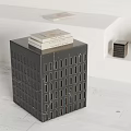 Modern Black Marble Side Table With Perforated Design And Stacked Books On Top