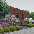 Red Brick Building With Arched Windows Surrounded By Trees Landscaped Garden And Stone Steps