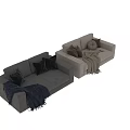 Light Beige and Gray Two Seater Sofa with Brown Black Pillows and Beige Blue Blanket