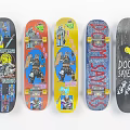 Five Skateboards With Colorful Graphic Designs And Distinctive Artwork Prints