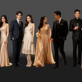 Group of Well Dressed People in Formal Suits and Evening Gowns Posing Together