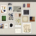 Various Abstract Artworks Hanging On White Wall With Different Styles