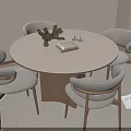 Modern Round Dining Table with Light Gray Chairs Wooden Legs Green Plant Book and Candles