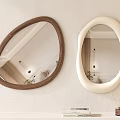 Irregular Mirrors With Brown And White Frames On Wall With Books Below Aroma Sticks