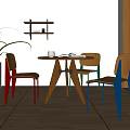 Round Wooden Dining Table Set With Three Chairs And Colorful Legs In Natural Light