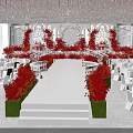Elegant Wedding Banquet Hall With Crystal Chandelier Red Floral Decorations White Stage And White Chairs