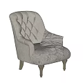 Gray Tufted Armchair with Wooden Legs and Striped Throw Blanket with Tassels