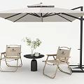 Outdoor Leisure Chairs Setup with Patio Umbrella Small Round Table and Potted Plant